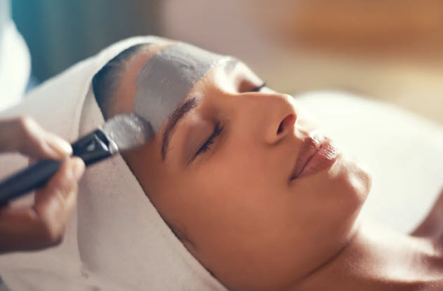 women getting a facial